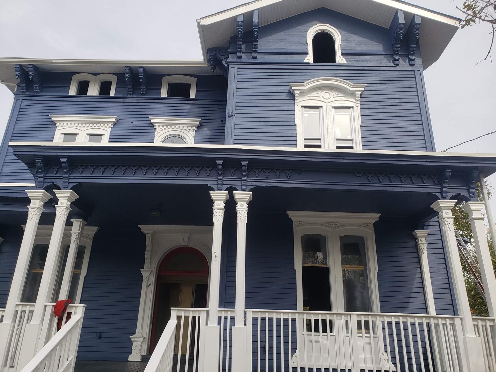Full Victorian exterior repaint with restored trim and detail work